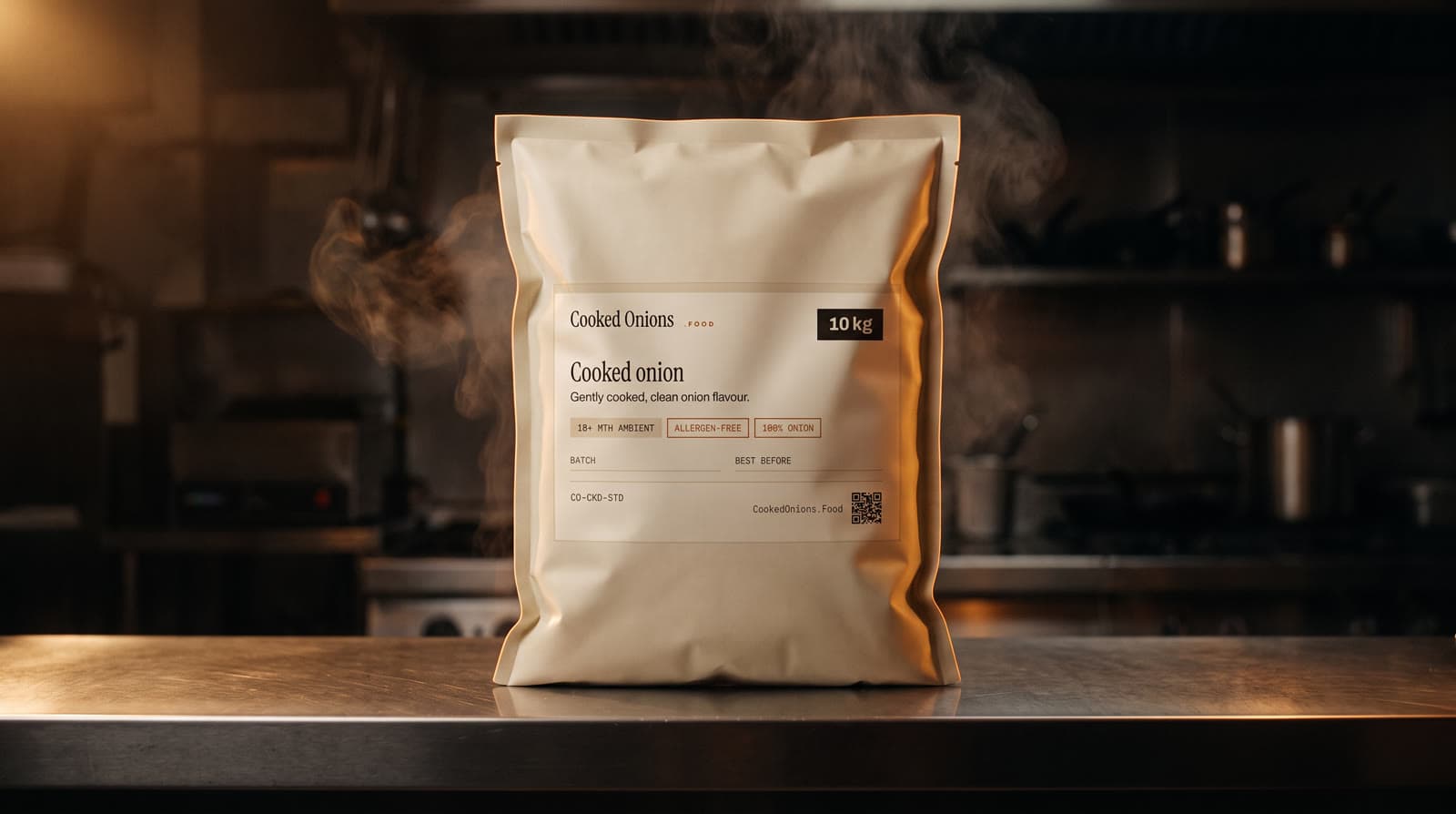 A 10 kg Cooked Onions retort bag standing on a steel counter in a professional kitchen